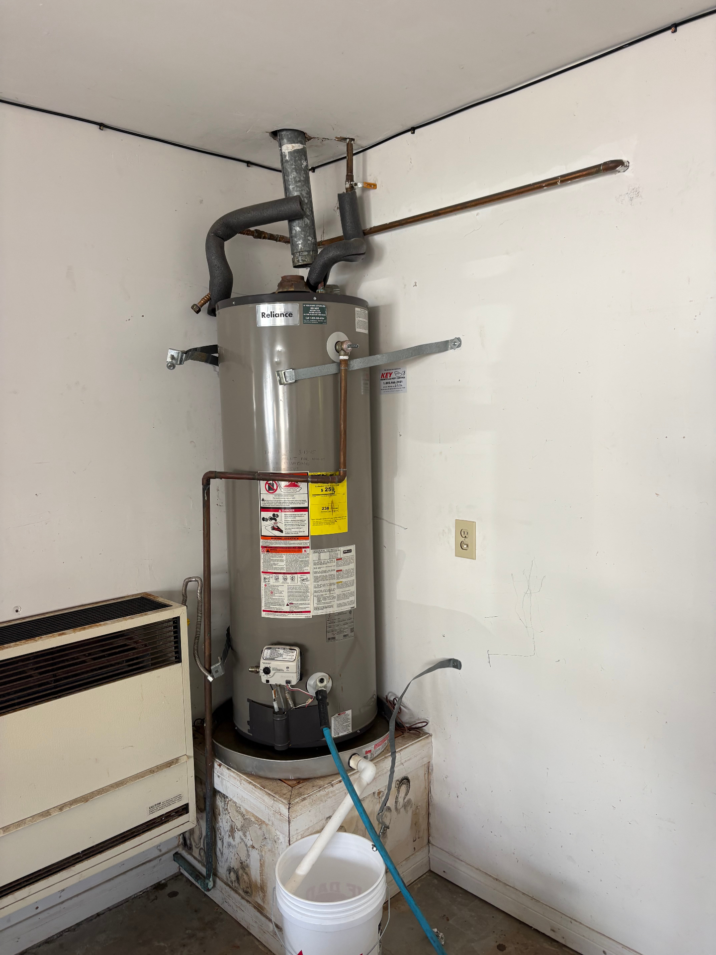 Old Reliance gas water heater before replacement
