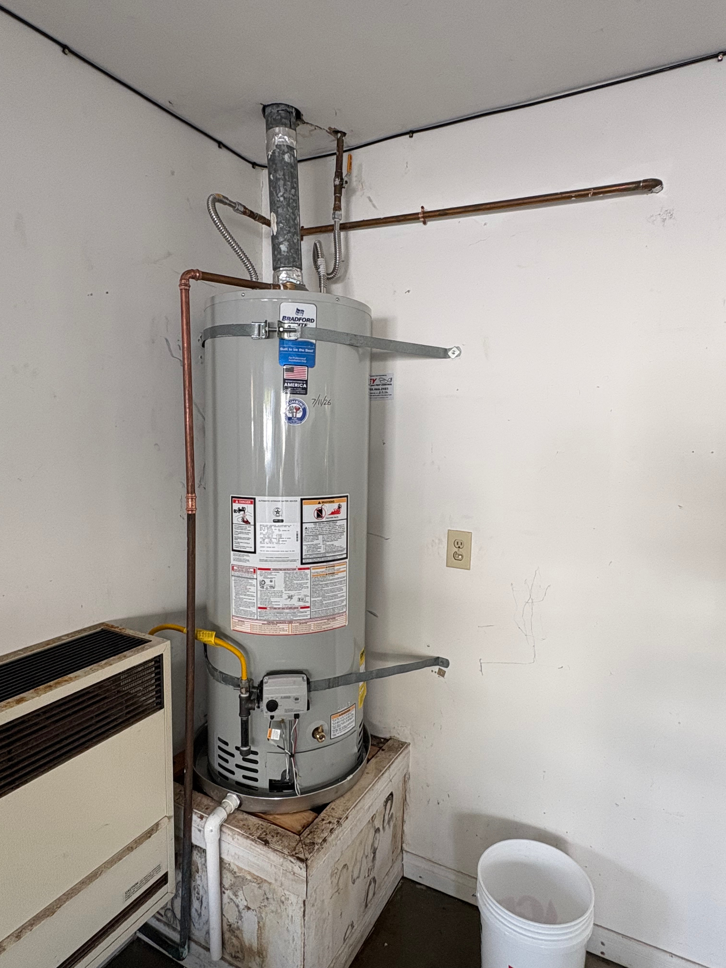 New Bradford White gas water heater installation with seismic strapping