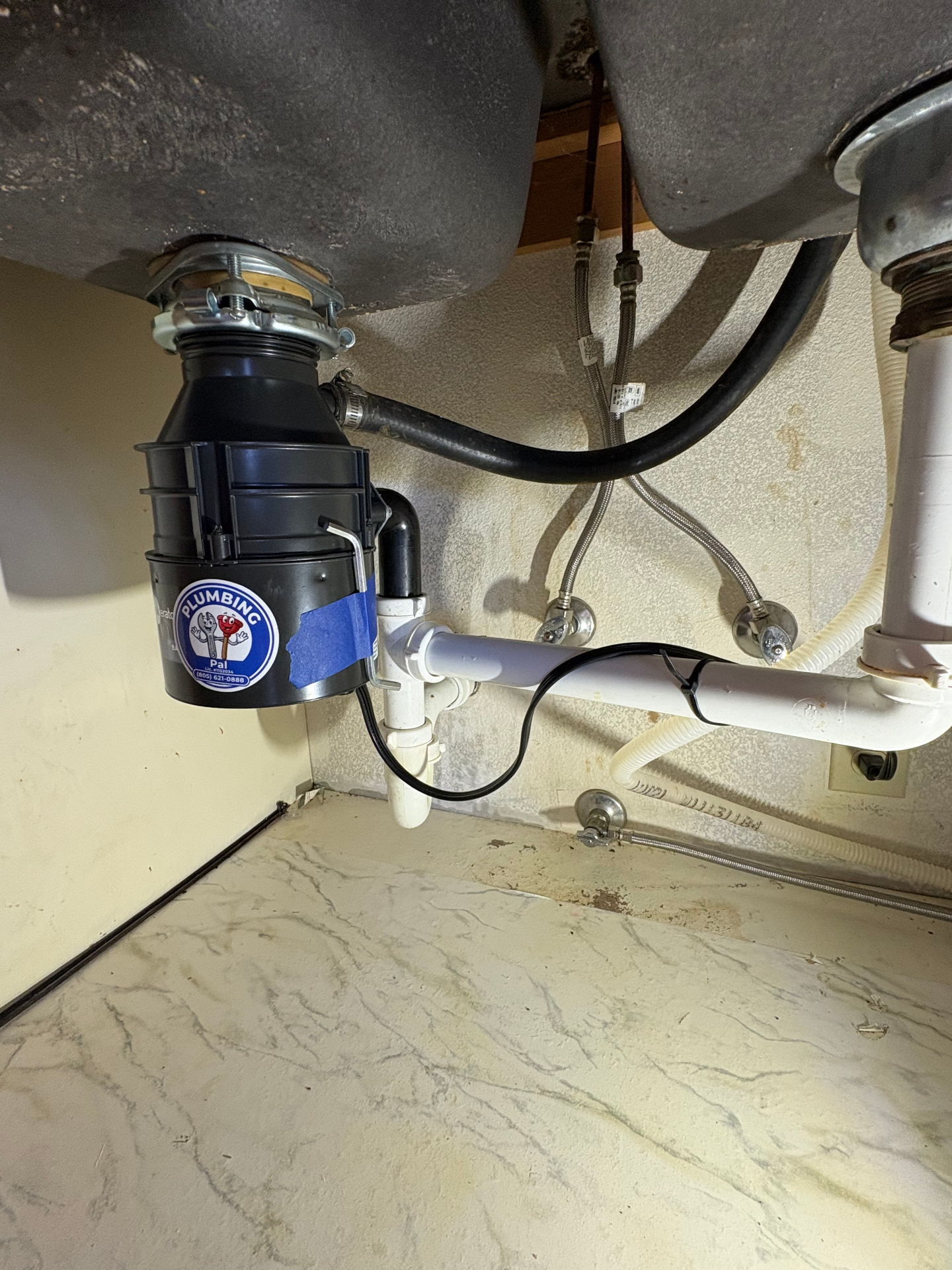 Under-sink garbage disposal installation by Plumbing Pal