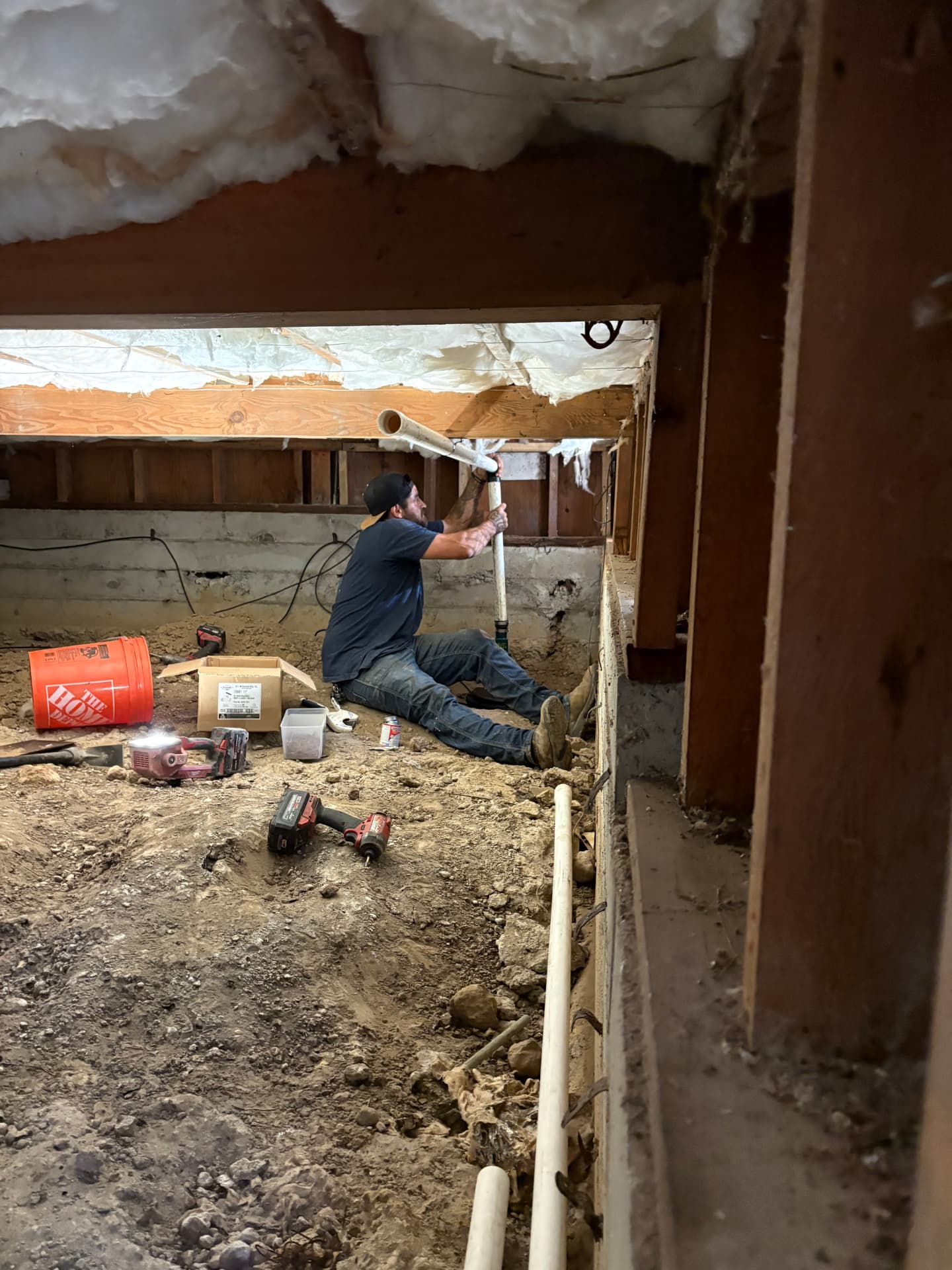 Crawlspace drain line replacement and repipe under a home