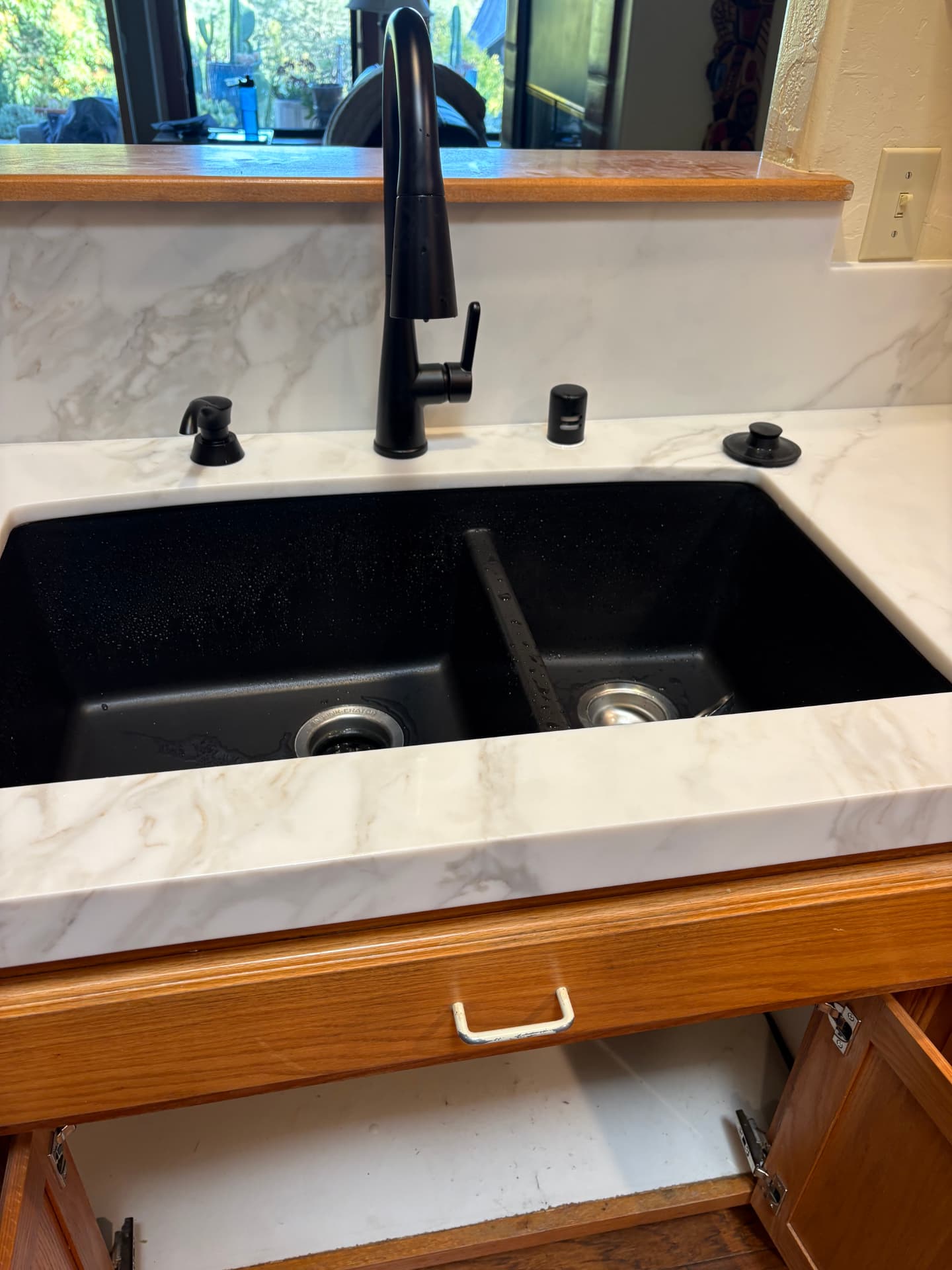 New matte black pull-down kitchen faucet with composite sink install
