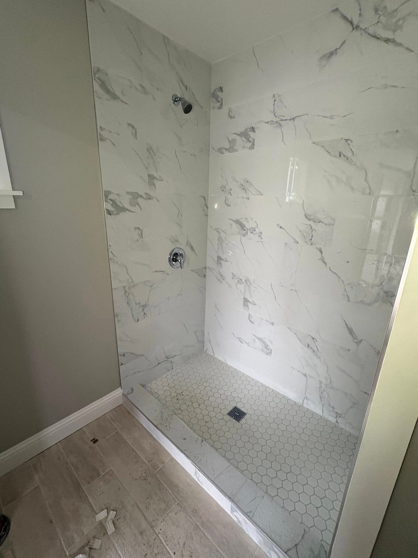New marble-tile shower installation by Plumbing Pal